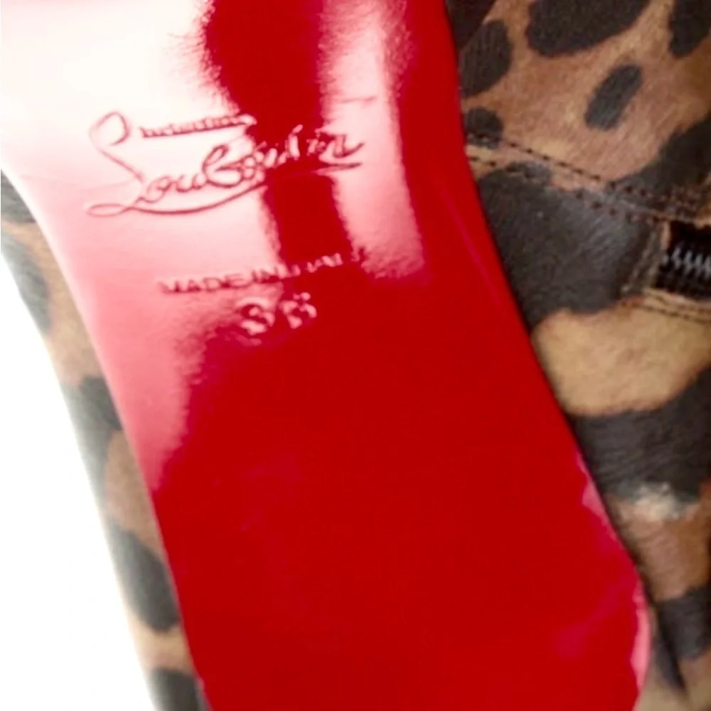 Christian Louboutin animal Leo print kid leather ankle platform bootie. EU36